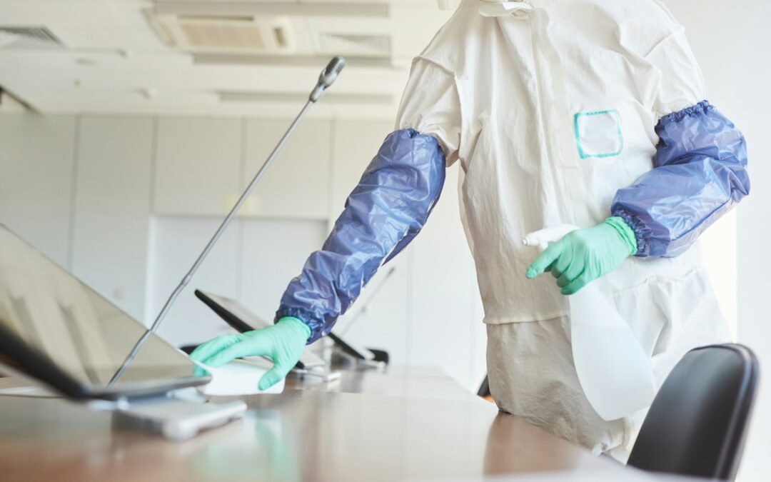 Worker Cleaning Office Table Close Up